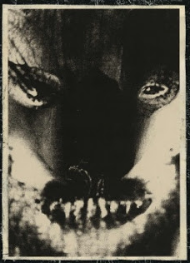 A dark image of a skull from the cover of Vital by Grim